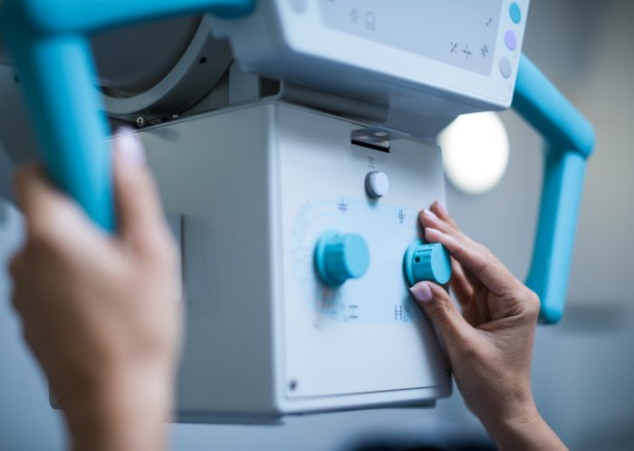 doctor sets up the machine to x ray over patient 2025 04 04 11 04 49 utc scaled