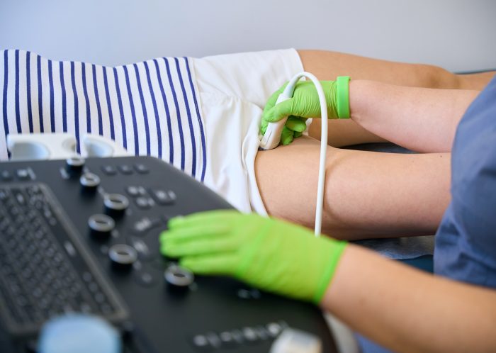 woman lies on medical couch for ultrasound scan of 2024 10 20 00 24 15 utc scaled